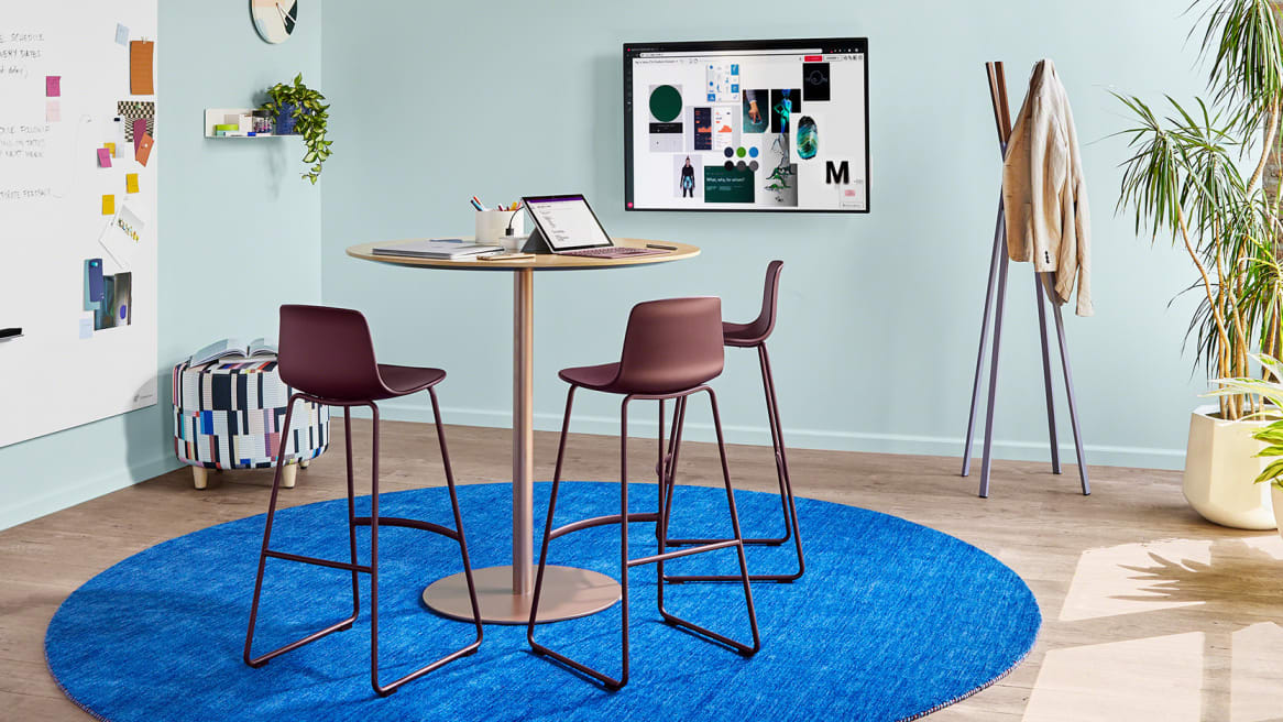 Small meeting room with Enea Lottus seating, a3 CeramicSteel Sans whiteboard, and Steelcase Roam